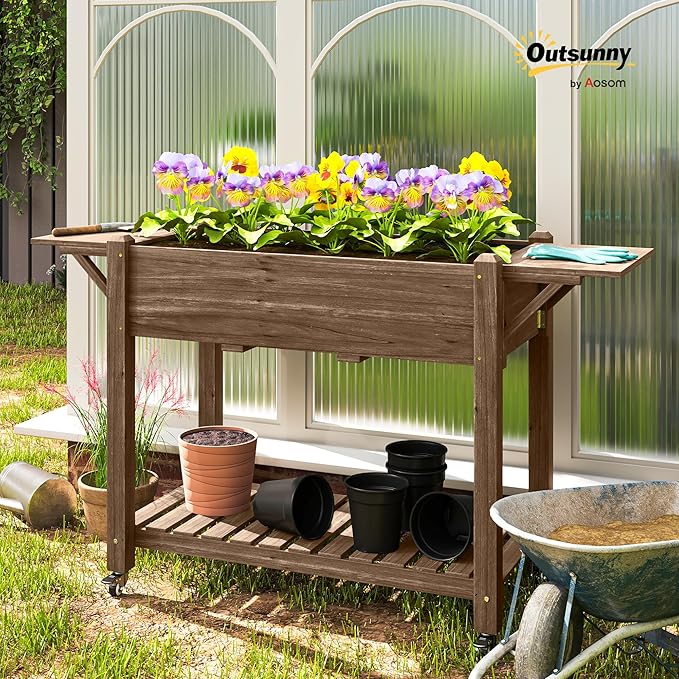 Outsunny Raised Garden Bed, 57 x 20.5 x 34 in Wood Elevated Planter Box with Lockable Wheels, Side Tables and Bottom Shelf, Outdoor Raised Planter with Bed Liner and Drainage Holes, Carbonized